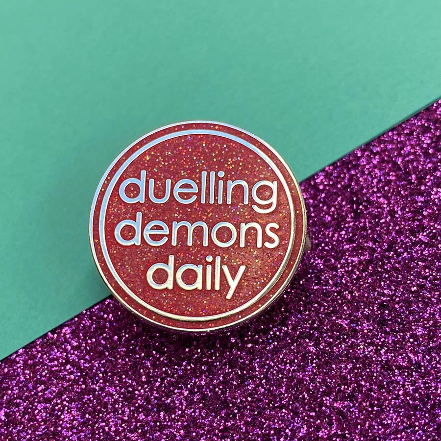 Duelling Demons Glitter Enamel Pin
