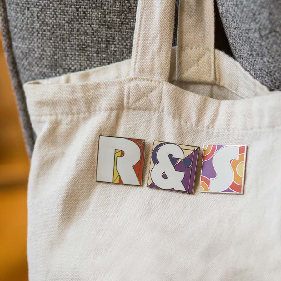 Make your bag personalized with letter pins that can be removed and replaced as you see fit. 